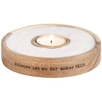 Windlicht mit Sand und Text von Räder Design beleuchtet
