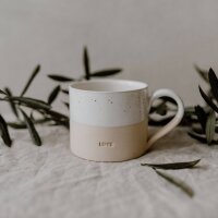 zweifarbige Tasse in weiß und creme mit...